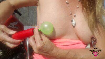 Nippleringlover Horny Milf Sticking Balloons Through Extreme Stretched Pierced Nipples Outdoors - hclips
