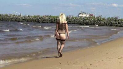 Pretty Woman In A Nylon Bodysuit On The Beach - hclips